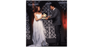 Shrine Event Founder receiving award from Malaika Arora